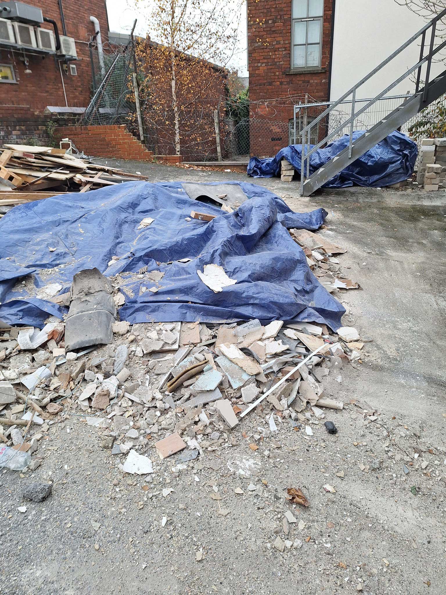 ground is filled with rubble and rubbish