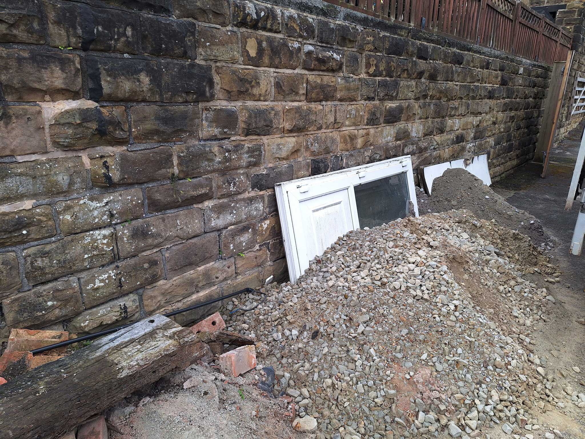 alley commercial door and rubble and gravel