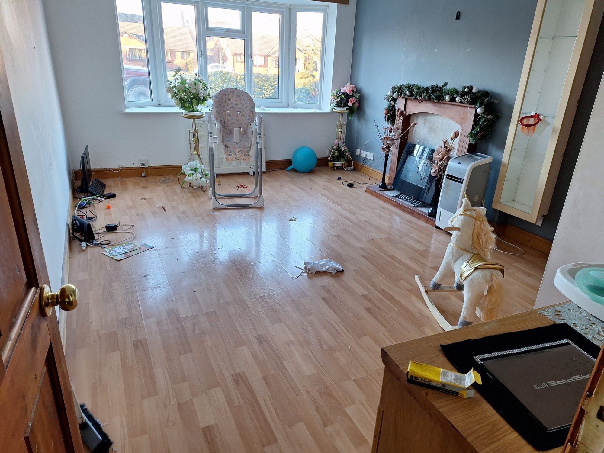 messy living room with furniture to be removed